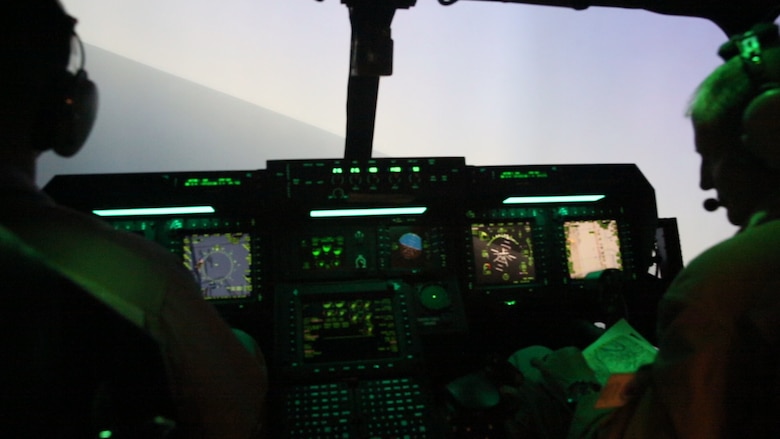 Pilots with Marine Medium Tiltrotor Squadron (VMM) 364 operate an MV-22 Osprey flight simulator during Virtual Flag aboard Marine Corps Air Station Camp Pendleton, Calif., May 18. Virtual Flag is the flagship event for the U.S. Air Force Distributed Missions Operations Center of Excellence (DMOC) and is a quarterly exercise among military branches using various aircraft and mechanized simulators across the country. (U.S. Marine Corps photo by Sgt. Brian Marion/Released)