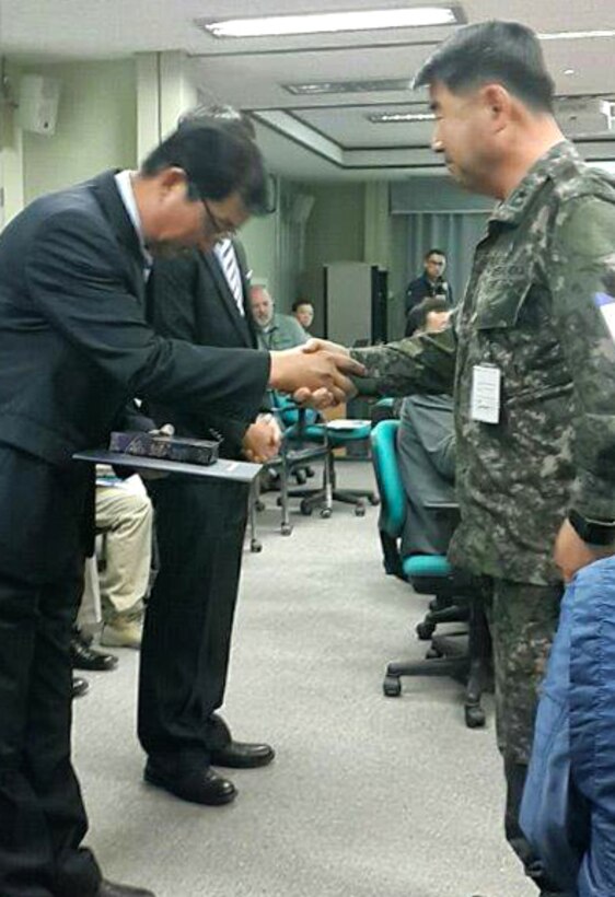 Mr. Chang, U-Ik, of the Far East District's Safety Office, received a letter of appreciation from BG Kang, Dae-Nam, the current MURO Chief, on June 1, 2016, at Camp Humphreys. The letter of appreciation was signed by BG Kim, Ki Su, MURO, who recently retired. Mr. Chang received the letter of appreciation due to his efforts in reducing accidents by MURO personnel. Col. Bales, Far East District commander, was in attendance at the presentation.