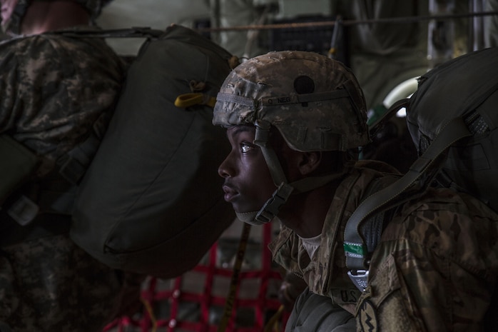 A U.S. Army Pfc. Prepares to jump from a Marine Aerial Refueler Transport Squadron 152 KC-130J Super Hercules aircraft during exercise Kodiak Mace at Joint Base Elmendorf-Richardson, Alaska, May 25, 2016. The squadron traveled from Marine Corps Air Station Iwakuni, Japan to train with the 4th Infantry Brigade Combat Team, 25th Infantry Division in Alaska to support the exercise. Kodiak Mace is an annual joint exercise designed to give the U.S. Marine pilots the opportunity to train with the airborne division in an effort to increase combat readiness. (U.S. Marine Corps photo by Cpl. Cory Schubert/Released)