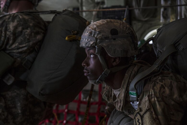 A U.S. Army Pfc. Prepares to jump from a Marine Aerial Refueler Transport Squadron 152 KC-130J Super Hercules aircraft during exercise Kodiak Mace at Joint Base Elmendorf-Richardson, Alaska, May 25, 2016. The squadron traveled from Marine Corps Air Station Iwakuni, Japan to train with the 4th Infantry Brigade Combat Team, 25th Infantry Division in Alaska to support the exercise. Kodiak Mace is an annual joint exercise designed to give the U.S. Marine pilots the opportunity to train with the airborne division in an effort to increase combat readiness. (U.S. Marine Corps photo by Cpl. Cory Schubert/Released)