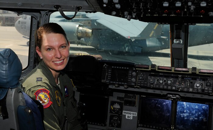 U.S. Air Force Capt. Rachael DeRoche, a pilot from the 15th Airlift Squadron, poses for a photo inside cockpit of a C-17 Globemaster III June 3, 2016, at Joint Base Charleston, S.C. DeRoche and her flight crew took on an additional mission to transport a patient from Tegucigalpa, Honduras to Tampa General Hospital May 19, 2016. (U.S. Air Force photo/Airman 1st Class Kevin West)