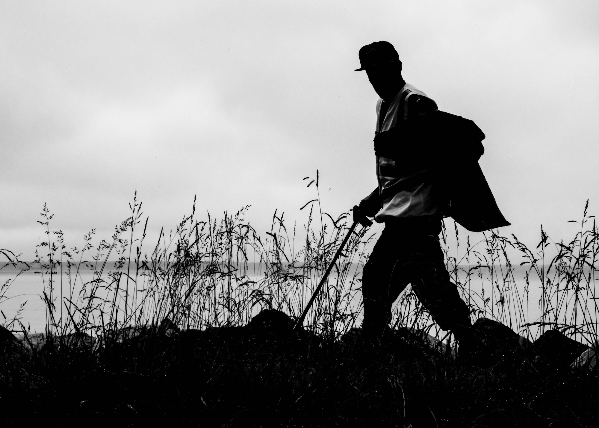 Don Johnson, environmental program manager and specialist assigned to the 733rd Civil Engineer Division, searches for trash and debris along the shoreline at Fort Eustis, Va., June 4, 2016. Volunteers Clean the 200-mile-long estuary that runs from Havre de Grace, Md., to Norfolk, Va., as well as the 50 major rivers, creeks and streams that pour into the Chesapeake Bay each day. (U.S. Air Force photo by Staff J.D. Strong II)