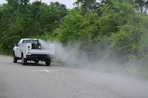 Mitch Burcham, 633rd Civil Engineer Squadron Entomology flight pest controller, drives a truck with a fog machine marked “Contaminated with Pesticides,” to eradicate the mosquito populations at Langley Air Force Base, Va., June 6, 2016. Pest controllers will fog three nights each week from 7 p.m. to approximately 11 p.m., provided the weather permits, through Bethel housing, housing on Langley Air Force Base, followed by the industrial and office buildings across the installation. (U.S. Air Force photo by Staff Sgt. Teresa J. Cleveland)