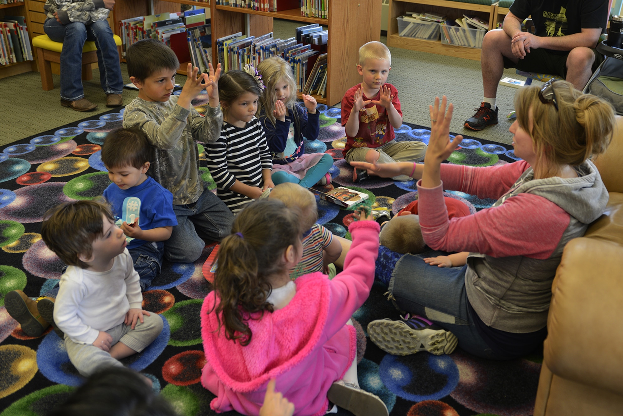 Preschool children attend an American Sign Language class designed at the Joint Base Elmendorf-Richardson Library, Alaska, June 4, 2016. ASL is the third most widely used language in the U.S. (U.S. Air Force photo by Airman 1st Class Valerie Monroy)