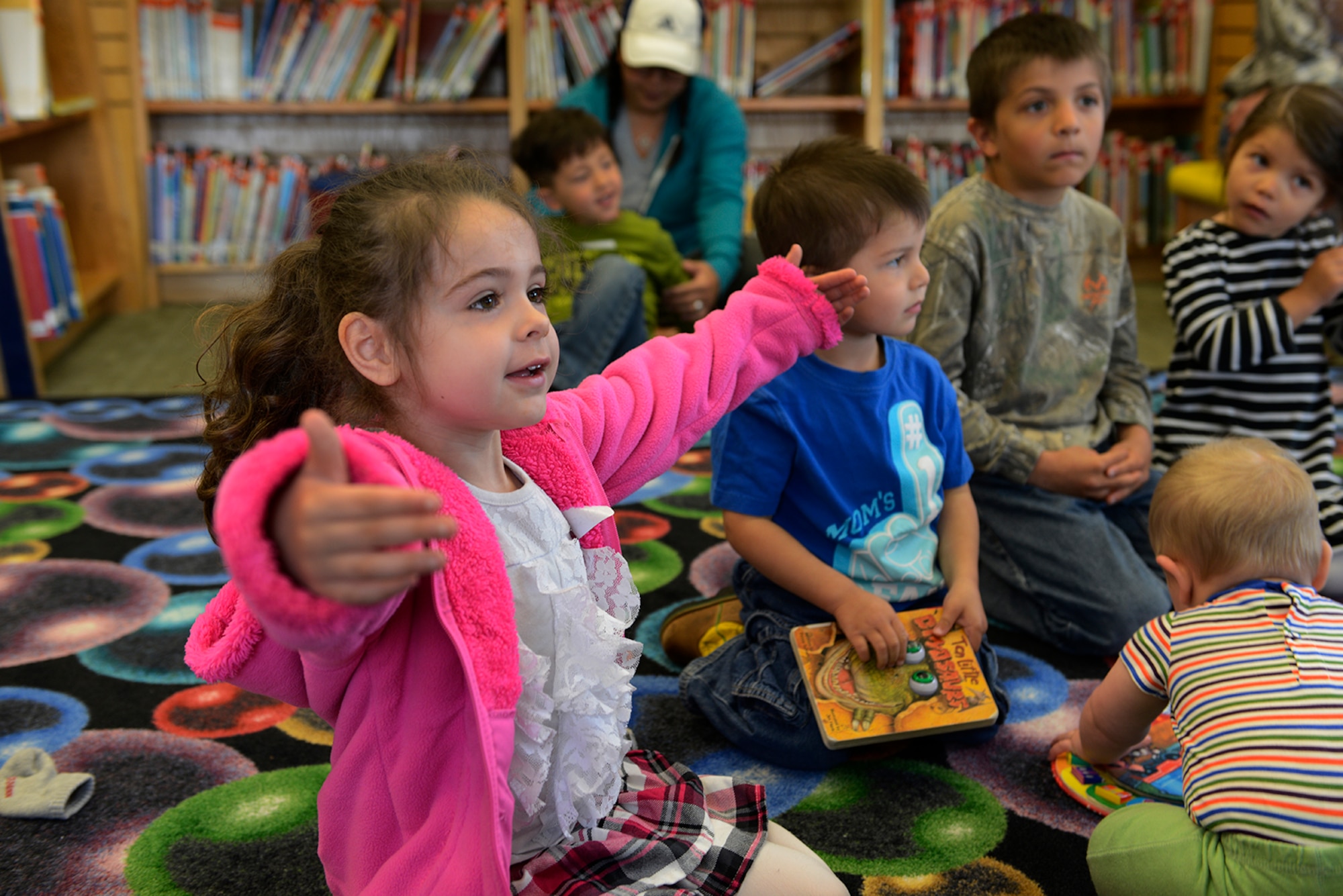 Allison Taylor, 4, attends an American Sign Language class designed for preschool children at the Joint Base Elmendorf-Richardson Library, Alaska, June 4, 2016. The library offers many ASL lessons on video for those who wish to learn sign language at home. (U.S. Air Force photo by Airman 1st Class Valerie Monroy)