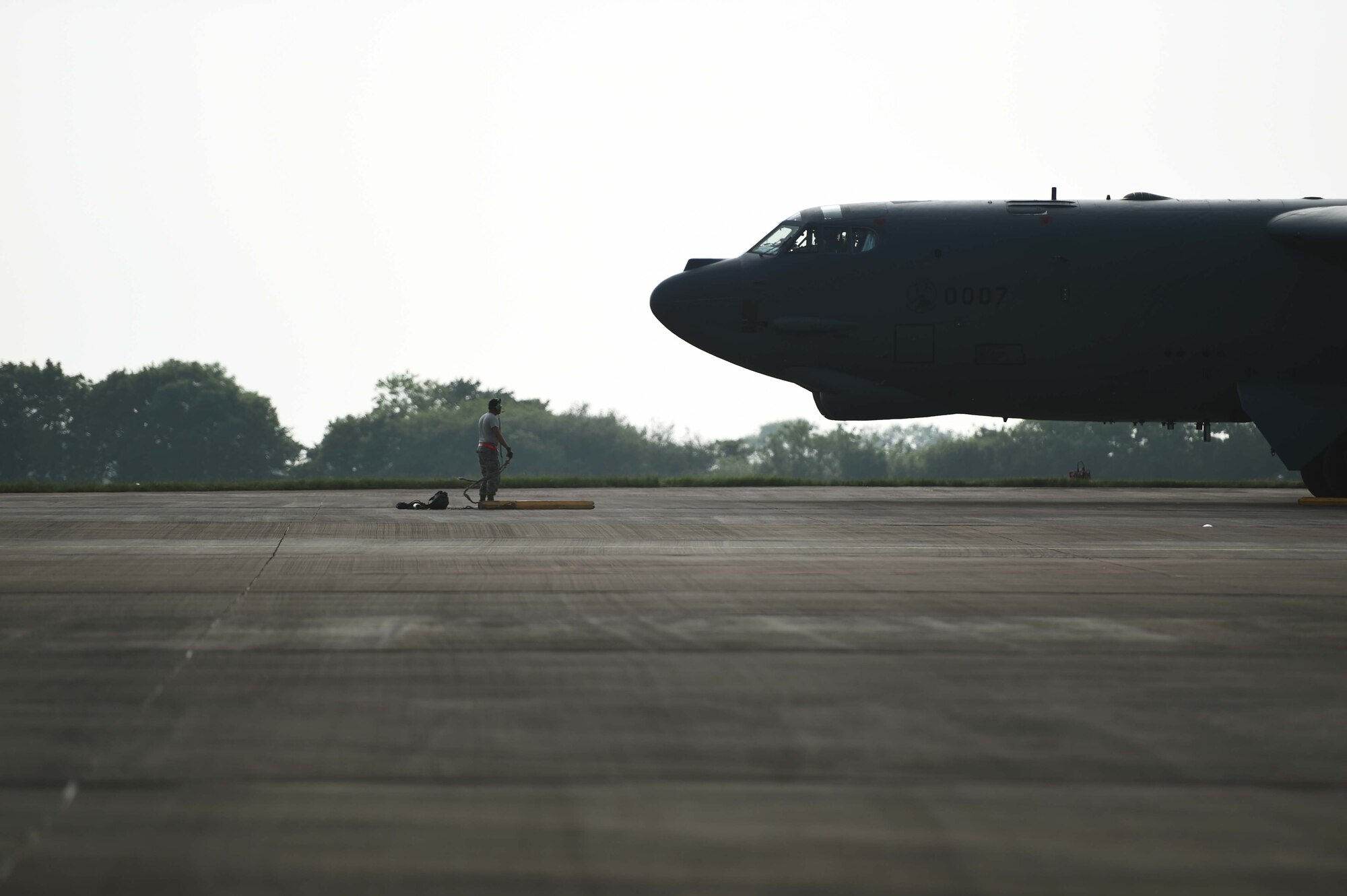 A B-52H Stratofortress from Minot Air Force Base, N.D., is marshalled into place on Royal Air Force Fairford, United Kingdom, after flying a training sortie June 7, 2016, in support of exercise BALTOPS 16. The sortie flown was the first training mission conducted in support of BALTOPS by the Air Force Global Strike Command aircrew. (U.S. Air Force photo/Airman 1st Class Zachary Bumpus)