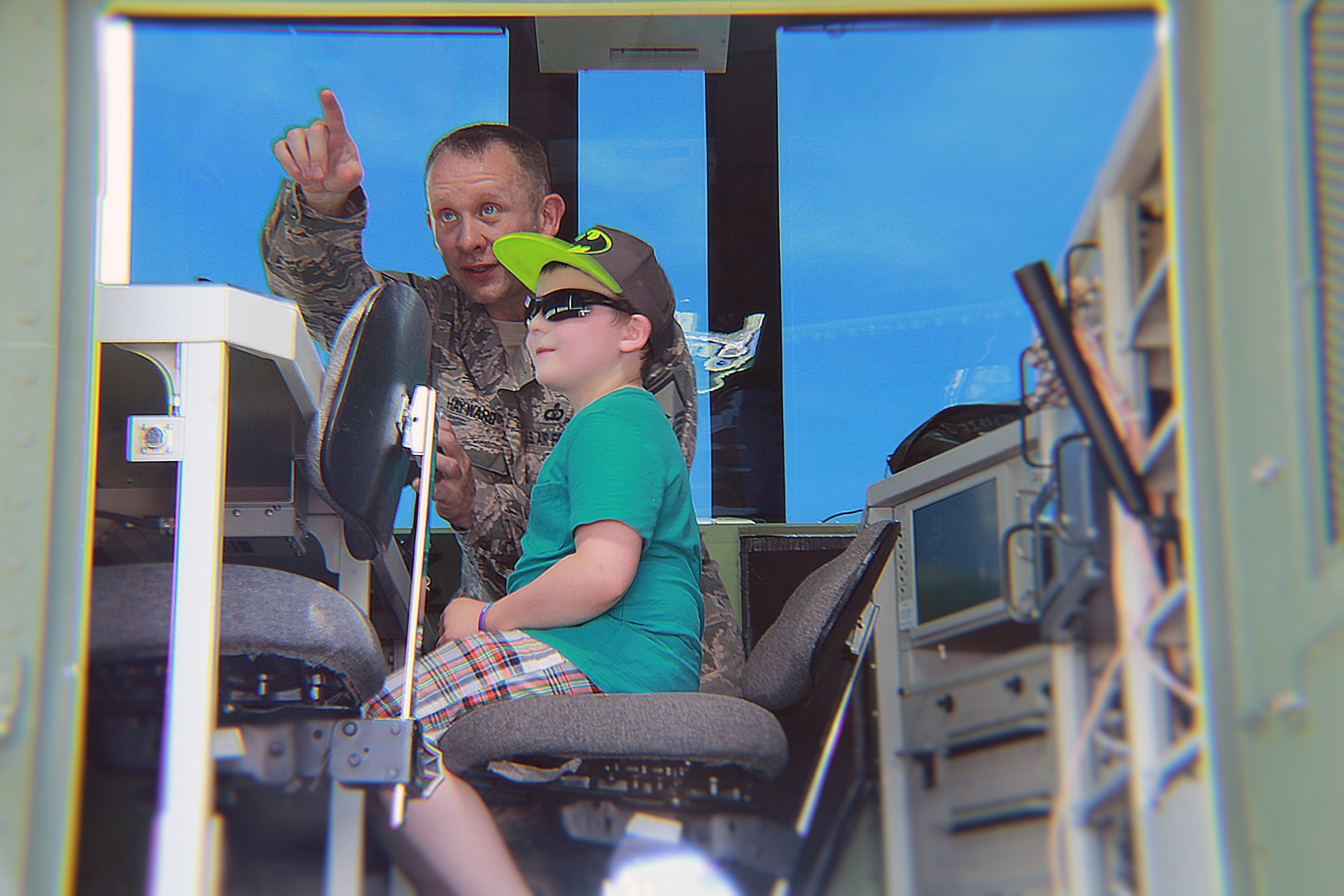 U.S. Air Force Senior Master Sgt. Mickey Hayward of the 260th Air Traffic Control Squadron gives a tour of the MSN-7 Mobile Control Tower to Andrew Schreiter of Lebanon, Maine at the Wings and Wheels community event in Rochester, N.H. June 4, 2016. The Airmen greeted and spoke with community members and families attending the event, and showed them how MSN-7 can be used for more than just military purposes. (U.S. Air National Guard photo by Staff Sgt. Kayla Rorick)