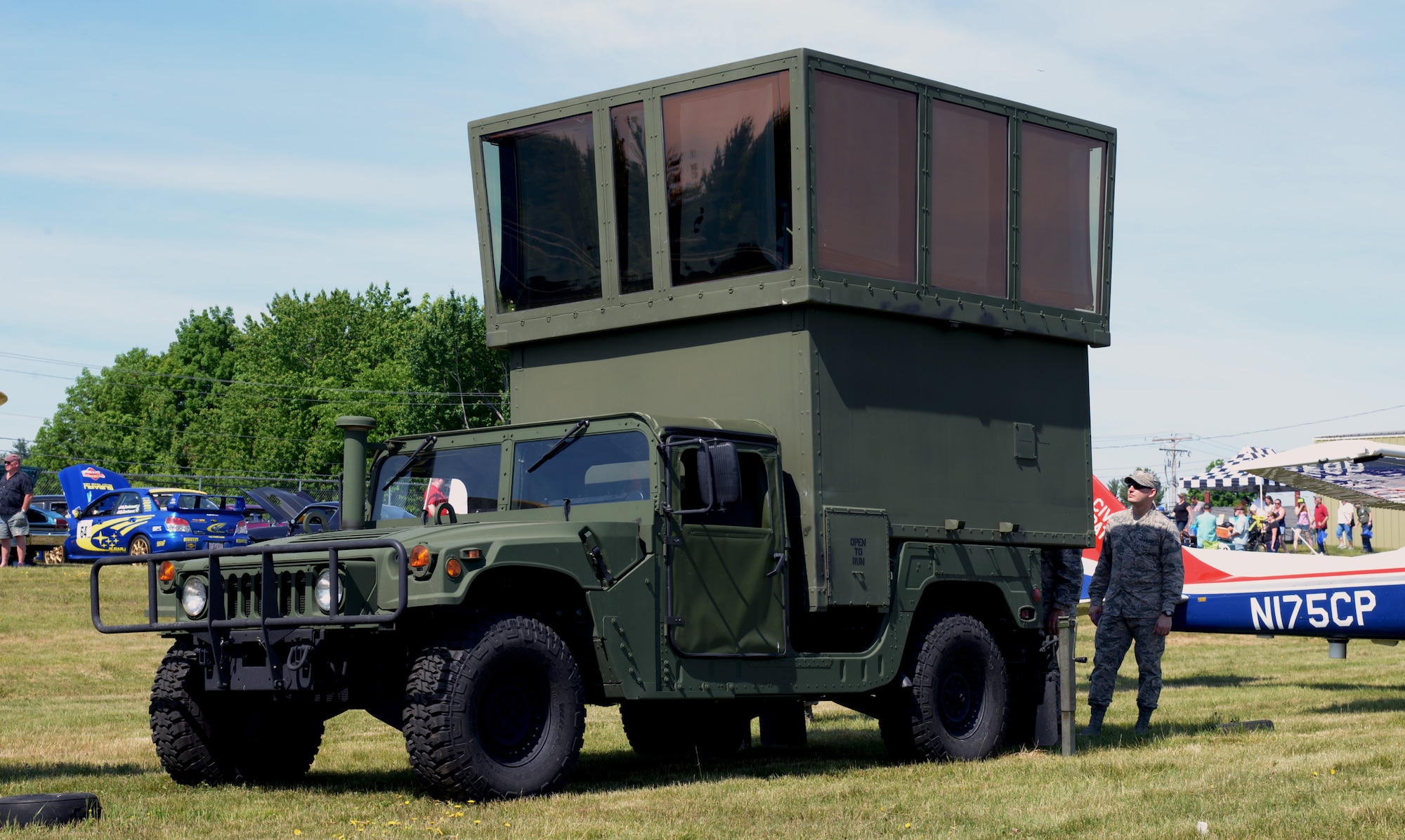 The 260th Air Traffic Control Squadron displayed their MSN-7 Mobile Control Tower at the Wings and Wheels community event in Rochester, N.H. June 4, 2016. The Airmen greeted and spoke with community members and families attending the event, and showed them how MSN-7 can be used for more than just military purposes. (U.S. Air National Guard photo by Airman 1st Class Ashlyn J. Correia)