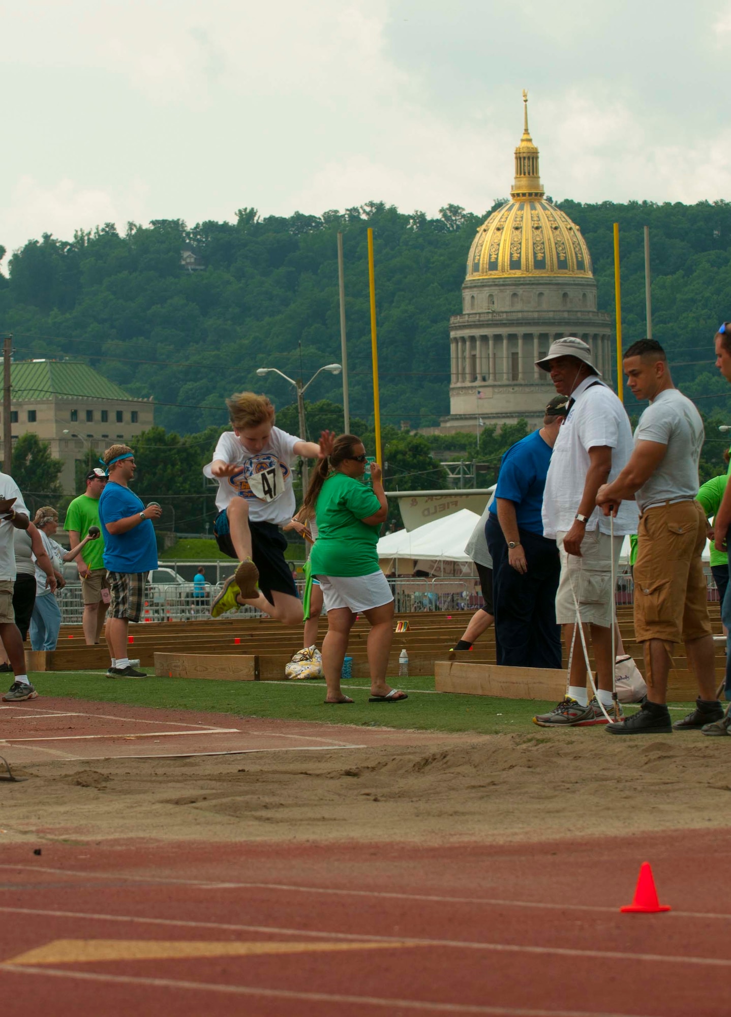 An athlete competes in the long jump during the 2016 Summer Special Olympics, Saturday, June 4, 2016 at University of Charleston Stadium, Charleston, W.Va. (U.S. Air National Guard Photo by Tech. Sgt. De-Juan Haley)