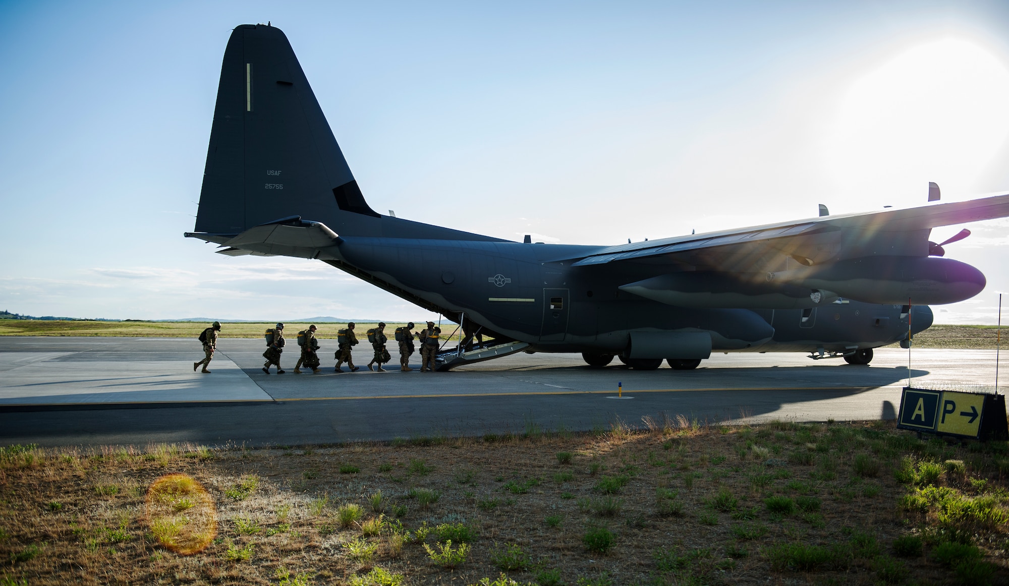 Survival, Evasion, Resistance and Escape specialists board a C-130 Globemaster before conducting a training jump May 25, 2016, at Fairchild Air Force Base, Wash. The Fairchild parachuting shop has started to map gear specific to the planes students will be flying on so when students go through training, they will be using the same parachute they receive in the field. (U.S. Air Force photo/Airman 1st Class Sean Campbell)