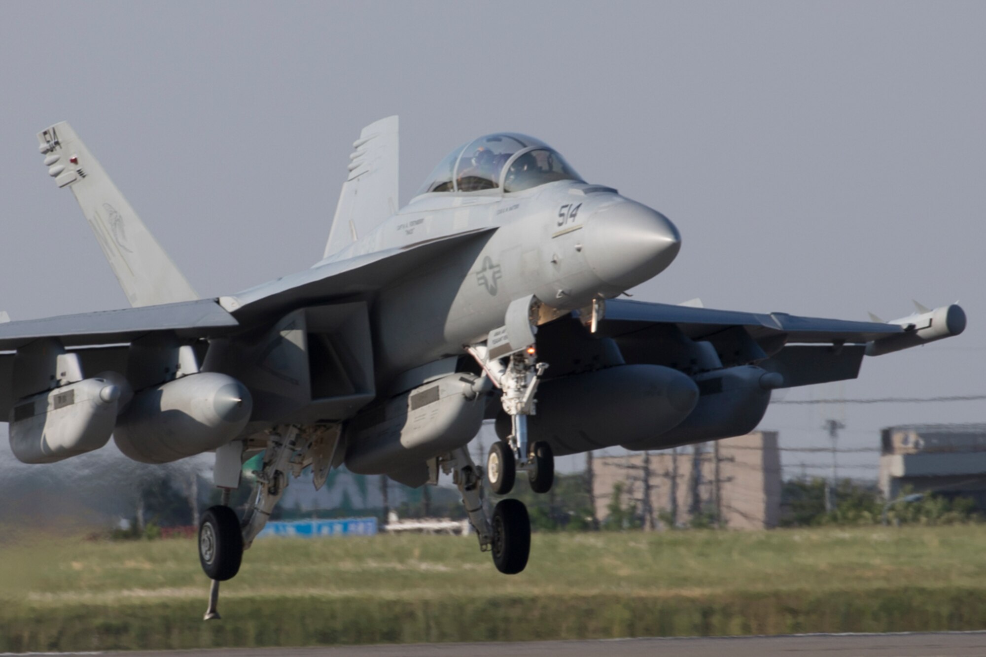 A Navy EA-18G Growler, assigned to the Electronic Attack Squadron (VAQ) 138, deploys a J-Hook to engage the aircraft arresting barrier system at Yokota Air Base, Japan, June 3, 2016. The 374th Civil Engineer Squadron power productions shop and fire department and 374th Operations Support Squadron airfield management flight are responsible for testing the system annually. (U.S. Air Force photo by Yasuo Osakabe/Released)