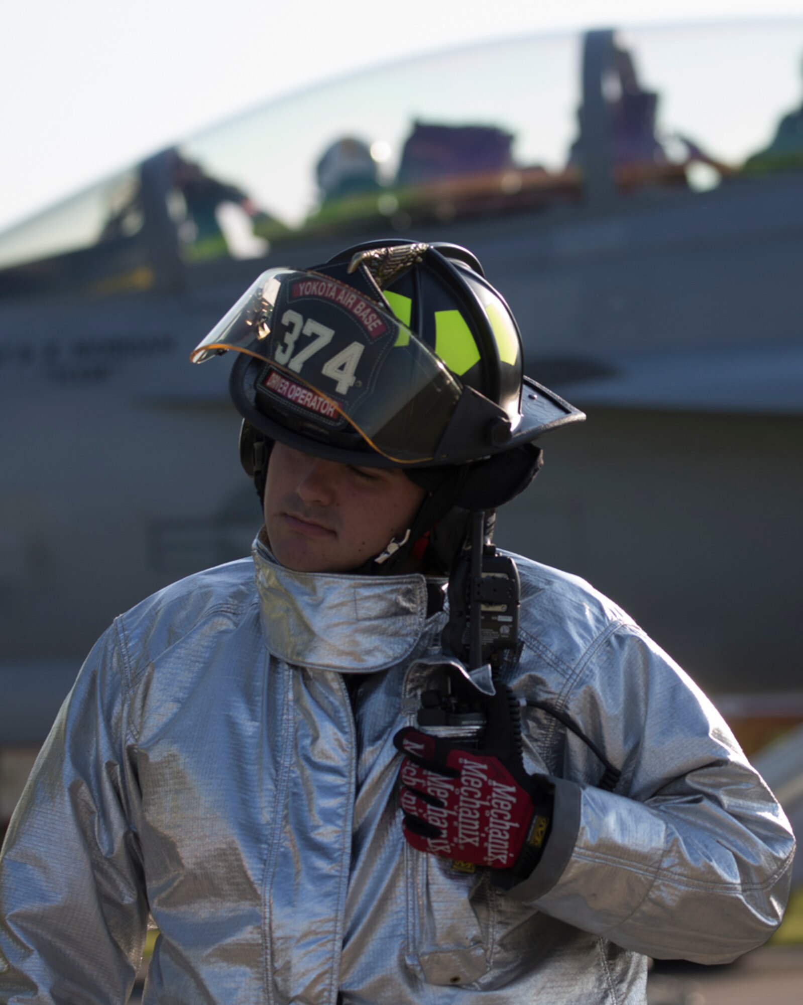 Senior Airman Kirk Ebel, 374th Civil Engineer Squadron firefighter, trains to respond to in-flight emergency landings during an annual certification test of an aircraft arresting system at Yokota Air Base, Japan, June 3, 2016. The 374th Civil Engineer Squadron power productions shop and fire department and 374th Operations Support Squadron airfield management flight are responsible for testing the system annually. (U.S. Air Force photo by Yasuo Osakabe/Released)