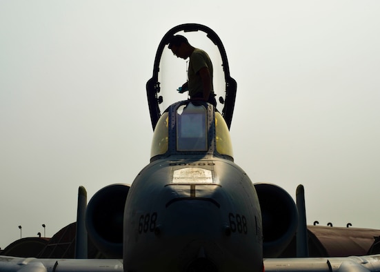 Senior Airman Paul Willett, 51st Aircraft Maintenance Squadron crew chief, cleans the inside of the canopy on an A-10 Thunderbolt II at Osan Air Base, Republic of Korea, June 9, 2016. Willett cleaned the canopy so nothing obstructs the vision of the pilot in the cockpit before training sorties are flown. (U.S. Air Force photo by Senior Airman Victor J. Caputo/Released)