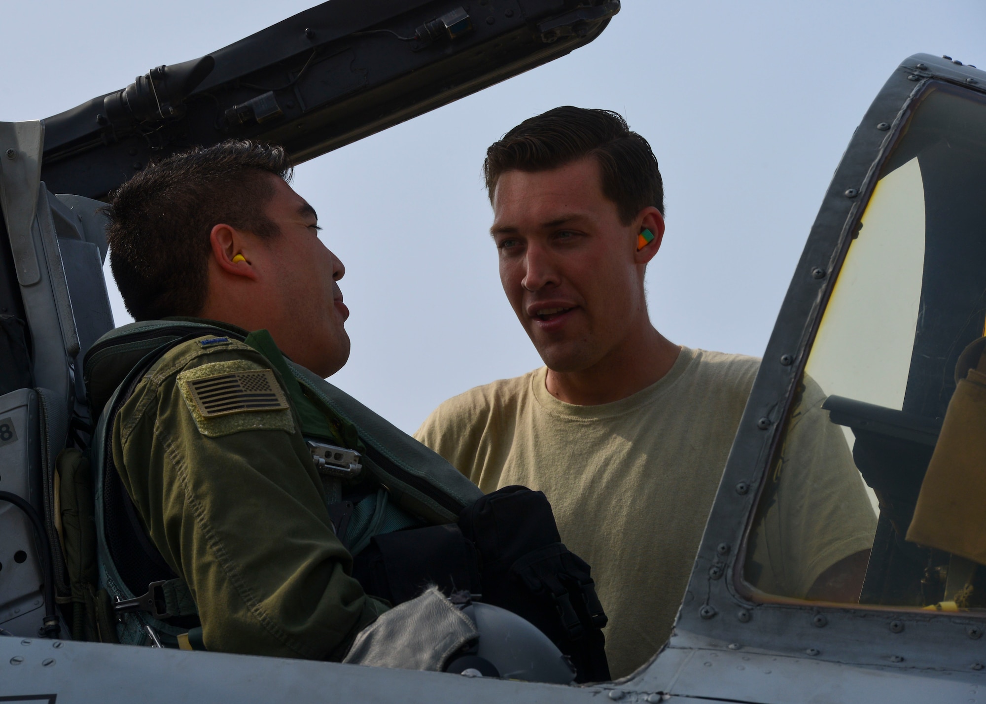 First Lt. Shannon Smith, 25th Fighter Squadron pilot, speaks with Senior Airman Paul Willett, 51st Aircraft Maintenance Squadron crew chief, before embarking on a training sortie at Osan Air Base, Republic of Korea, June 9, 2016. Crew chiefs prepare aircraft for takeoff and coordinate with pilots to ensure any possible issues are taken care of before takeoff. (U.S. Air Force photo by Senior Airman Victor J. Caputo/Released)