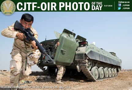 An Iraqi Army soldier exits an Infantry Fighting Vehicle during a training scenario at the Taji Military Complex, Iraq. Australian and New Zealand forces are assisting the Iraqi Army to enhance the ability of Iraqi soldiers to combat Daesh.