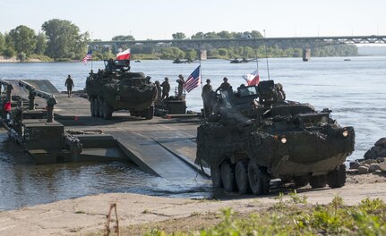 U.S. and U.K. Strykers are ferried across the Vistula River near Chelmno, Poland in a demonstration of the Amphibious Rig capabilities June 7 as part of a multinational event during Exercise Anakonda 2016. The ferries are created by connecting six Amphibious Rigs together, which are then capable of transporting military vehicles or supplies across a body of water.  Anakonda 2016 is a Polish-led, joint multinational exercise taking place throughout Poland June 7-17. The exercise involves more than 25,000 participants from more than 20 nations. Anakonda 2016 is a premier training event for U.S. Army Europe and participating nations and demonstrates the United States and partner nations can effectively unite under a unified command while training on contemporary scenario. (U.S. Army photo by Staff Sgt. Debra Richardson (Released)