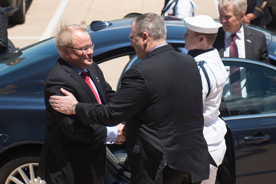 Deputy Defense Secretary Bob Work, right, greets Swedish Defense Minister Peter Hultqvist as he arrives at the Pentagon, June 8, 2016.  DoD photo by Air Force Senior Master Sgt. Adrian Cadiz