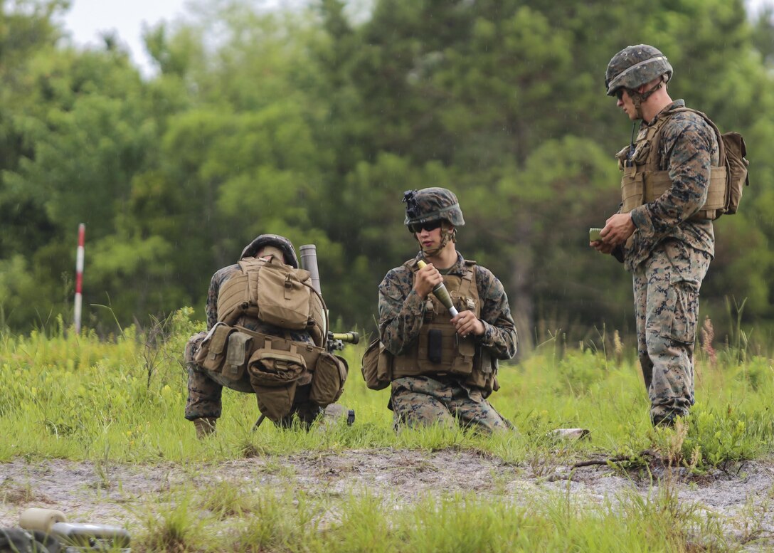 A mortar team with 1st Battalion, 2nd Marine Regiment, 2nd Marine Division, adjusts the mortar to the measurements provided to hit their targets during a training exercise at Camp Lejeune, N.C., June 6, 2016. Marines underwent mortar familiarization and proficiency training in preparation for their upcoming deployment in support of Special-Purpose Marine Air-Ground Task Force. 