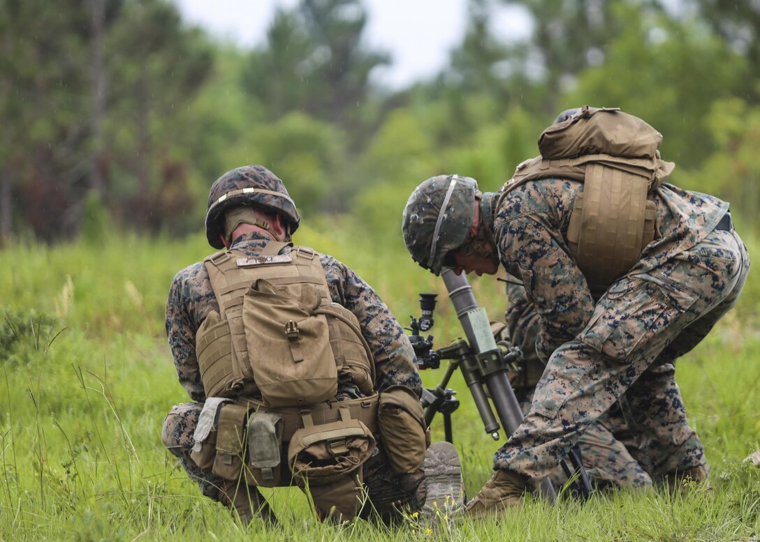 A section leader with 1st Battalion, 2nd Marine Regiment, verifies his mortar team has made the proper adjustments for the next course of fire during a training exercise at Camp Lejeune, N.C., June 6, 2016. Marines underwent mortar familiarization and proficiency training in preparation for their upcoming deployment in support of Special-Purpose Marine Air-Ground Task Force. 