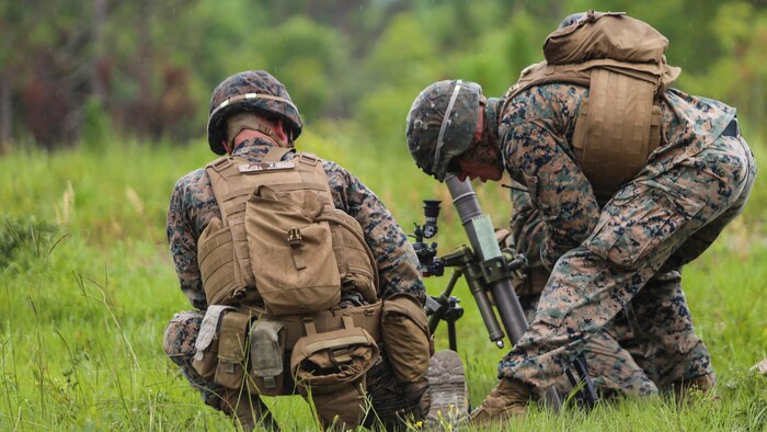 A section leader with 1st Battalion, 2nd Marine Regiment, verifies his mortar team has made the proper adjustments for the next course of fire during a training exercise at Camp Lejeune, N.C., June 6, 2016. Marines underwent mortar familiarization and proficiency training in preparation for their upcoming deployment in support of Special-Purpose Marine Air-Ground Task Force. 