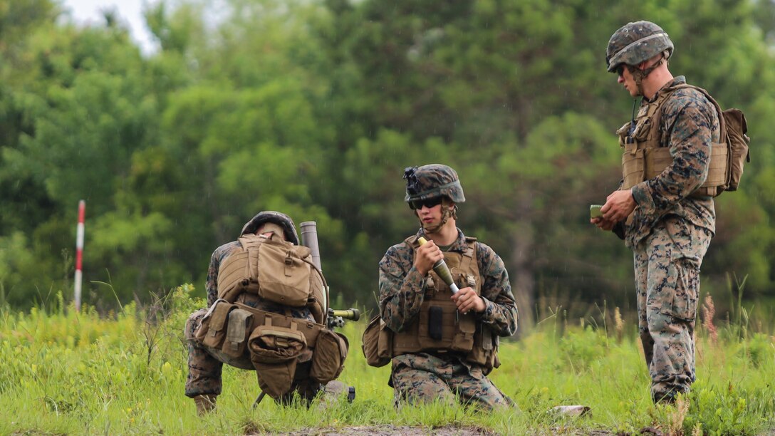 A mortar team with 1st Battalion, 2nd Marine Regiment, 2nd Marine Division, adjusts the mortar to the measurements provided to hit their targets during a training exercise at Camp Lejeune, N.C., June 6, 2016. Marines underwent mortar familiarization and proficiency training in preparation for their upcoming deployment in support of Special-Purpose Marine Air-Ground Task Force. 