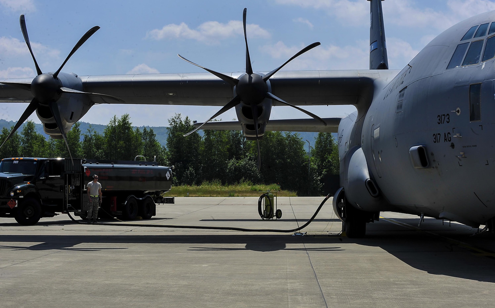 Airman 1st Class Zachary Hensley, 86th Logistics Readiness Squadron fuels operator, fuels a C-130J Super Hercules June 9, 2016, at Ramstein Air Base, Germany. Airmen from the 86th LRS provided support during Exercise Swift Response 2016 by continuously refueling aircraft to enable constant participation during the event. (U.S. Air Force photo/Senior Airman Larissa Greatwood) 