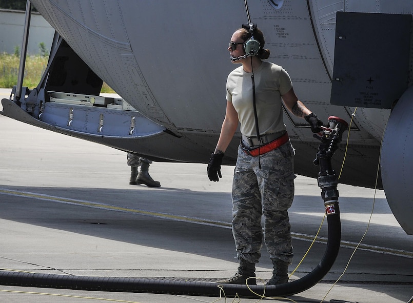Staff Sgt. Chelsie Busbin, 317th Aircraft Maintenance Squadron flying crew chief, removes a fuel hose after a refuel June 9, 2016, at Ramstein Air Base, Germany. More than 5,000 military members from 10 NATO countries are participating in this year’s annual Exercise Swift Response 2016 from May 27 through June 26. (U.S. Air Force photo/Senior Airman Larissa Greatwood)