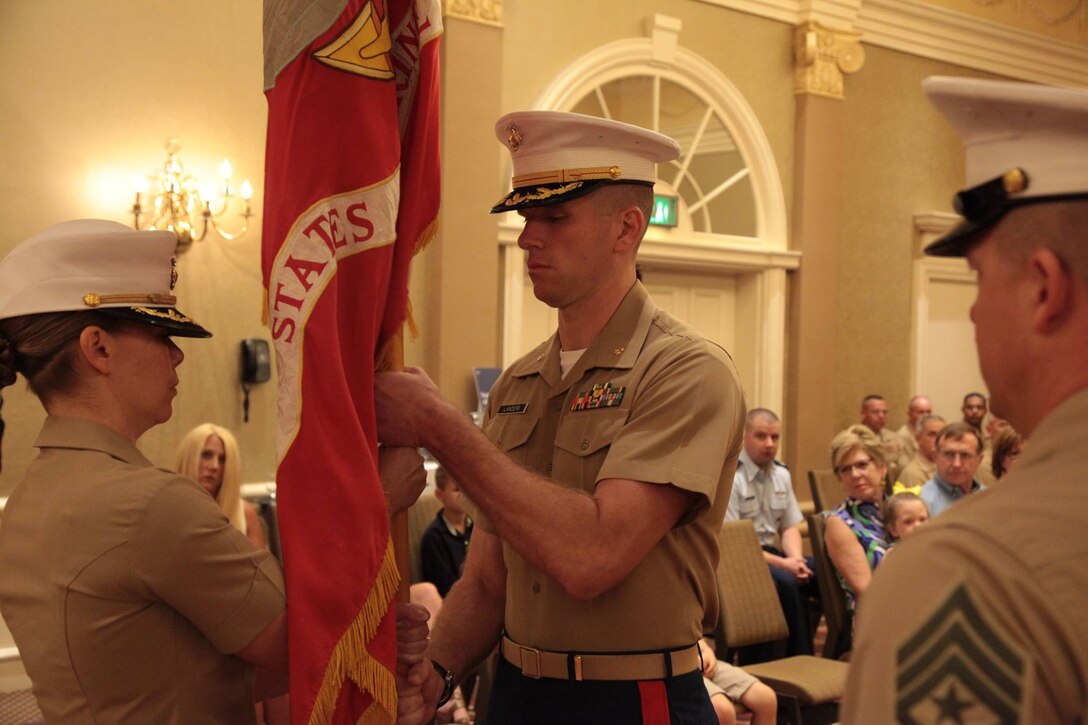 Maj Kathryn Wagner relinquishes command to Maj Jonathan Landers as the Commanding Officer for Recruiting Station Nashville, TN during the change of command ceremony at the Music City Sheraton Hotel June 8, 2016. “You are getting a truly professional and dedicated group of Marines that are ready to go in any direction you point to without fail,” said Maj Wagner to Maj Landers. “I am truly honored and humbled to be your new CO,” said Maj Landers to the Marines. “Nashville is where I wanted to be. There is nowhere else I wanted to be as CO then right here.” (Official Marine Corps photo by Sgt. Michael Iams)