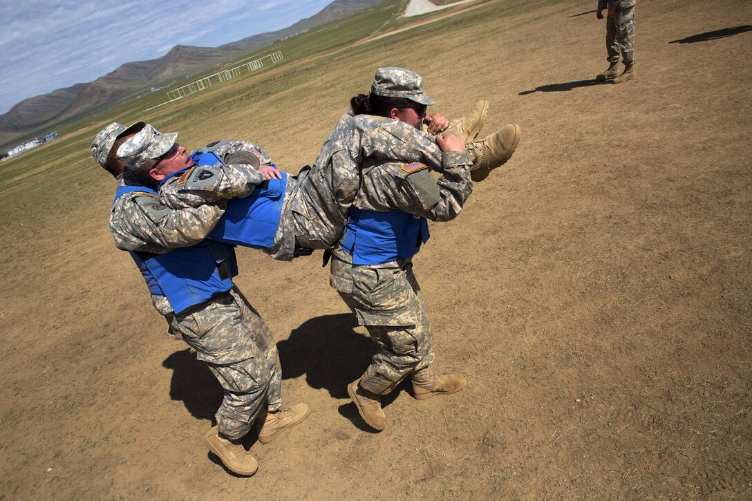 Soldiers practice patient transportation techniques during the combat medical care training lane of Khaan Quest 2016 at Five Hills training area near Ulaanbaatar, Mongolia, May 30, 2016. Marine Corps photo by Cpl. Janessa K. Pon