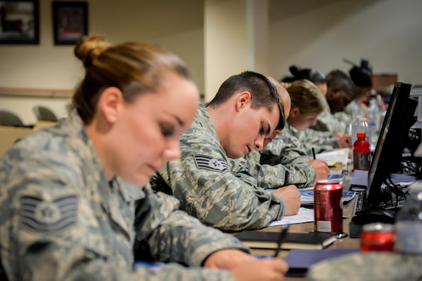 Participants fill out questionnaires during the 2016 Striker Stripe Conference held at Barksdale Air Force Base, La., June 8, 2016. (U.S. Air Force photo/Senior Airman Mozer O. Da Cunha)