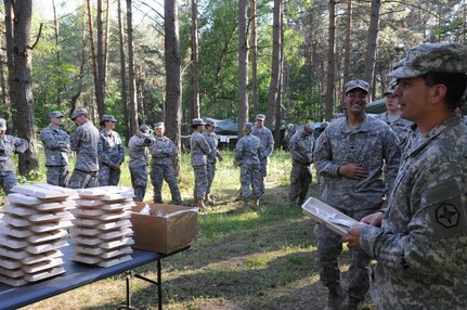 Soldiers participating in Anakonda 16 wait for food that is being served from a Mobile Kitchen Trailer (MKT) at the Drawsko Pomorskie Training Area in Poland. Anakonda 16 is a premier training event for U.S. Army Europe and participating nations and demonstrates that the United States and partner nations can effectively unite together under a unified command while training on a contemporary scenario. The MKT is being operated by soldiers from 483rd Quartermaster Company based in Marysville, Wash., and the 716th Quartermaster Company based in Jersey City, NJ. (Photo by Sgt. 1st Class Kenny Scott)