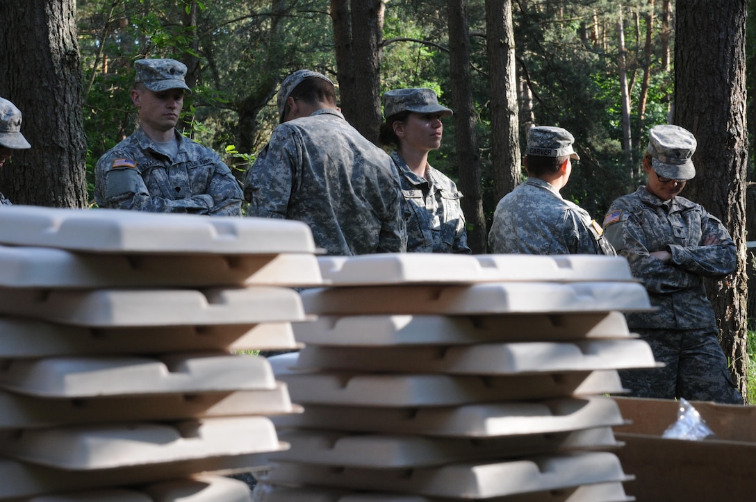 Soldiers participating in Anakonda 16 wait for food that is being served from a Mobile Kitchen Trailer (MKT) at the Drawsko Pomorskie Training Area in Poland. Anakonda 16 is a premier training event for U.S. Army Europe and participating nations and demonstrates that the United States and partner nations can effectively unite together under a unified command while training on a contemporary scenario. The MKT is being operated by soldiers from 483rd Quartermaster Company based in Marysville, Wash., and the 716th Quartermaster Company based in Jersey City, NJ. (Photo by Sgt. 1st Class Kenny Scott)