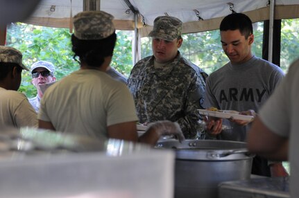 Soldiers participating in exercise Anakonda 16 pass through the Mobile Kitchen Trailer (MKT) at the Drawsko Pomorskie Training Area in Poland. Anakonda 16 is a Polish-led, joint, multinational exercise taking place in from June 7-17. The MKT is being operated by soldiers who are assigned to the 483rd Qutermaster Company based in Marysville, Wash., and the 716th Quartermaster Company based in Jersey City, NJ. (Photo by Sgt. Dennis Glass)