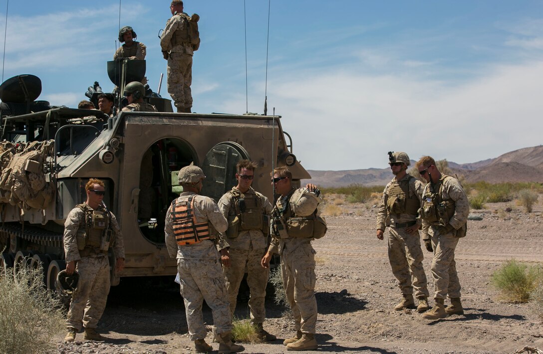 Capt. David Orick, training and plans officer, Tactical Training Exercise Control Group, speaks with Marines during the final exercise of Integrated Training Exercise 3-16 in the Blacktop Training Area aboard Marine Corps Air Ground Combat Center, Twentynine Palms, Calif., June 1, 2016. (Official Marine Corps photo by Lance Cpl. Dave Flores/Released)