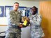 Staff Sgt. Olorunyomi Martins, an Individual Mobilization Augmentee paralegal at the 436th Airlift Wing legal office, is presented the Staff Judge Advocate of the Month Award by Lt. Col. Thomas P. Condie, the 436th Airlift Wing SJA.