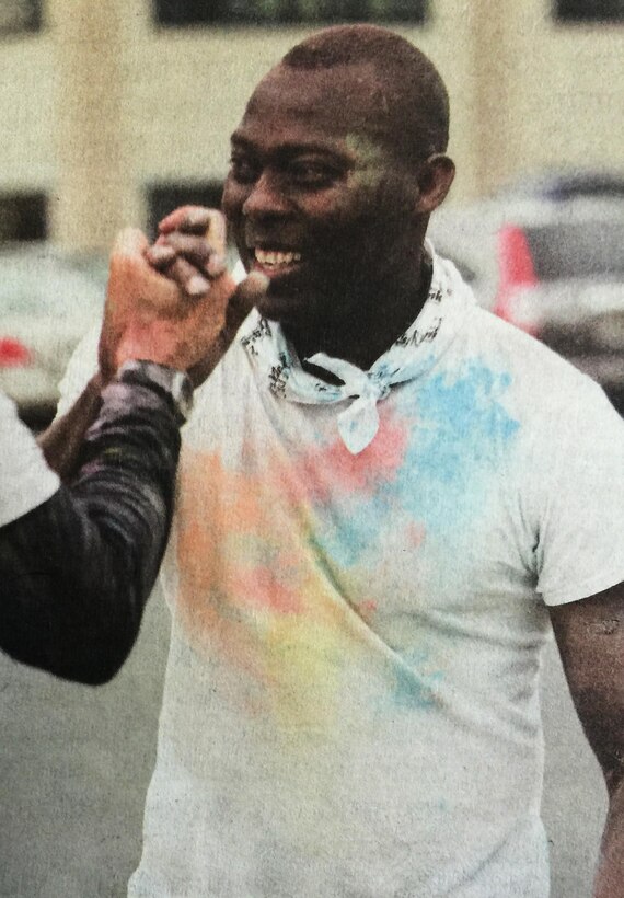 Staff Sgt. Olorunyomi Martins, the Individual Mobilization Augmentee with the 436th Airlift Wing's legal office pictured here following a unit color run, has an infectious smile and positive personality, says the legal office superintendent, Master Sgt. Michelle Palmer.
