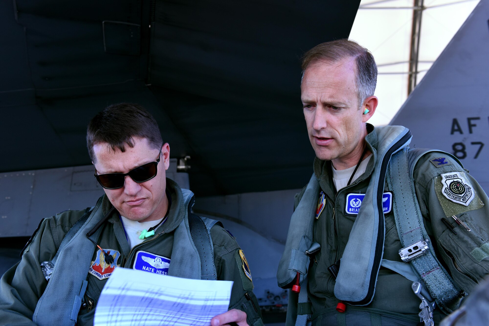 Lt. Col. Nate Hesse (left), 4th Operations Group deputy commander, and Col. Brian Afflerbaugh, 4th OG commander, review pre-flight information June 8, 2016, at Seymour Johnson Air Force Base, North Carolina. Afflerbaugh was completing his final mission as group commander. (U.S. Air Force photo/Tech. Sgt. Chuck Broadway) 
