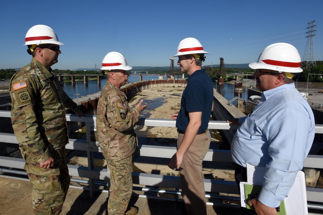 Lt. Gen. Todd T. Semonite (Second from Left), U.S. Army Corps of Engineers commander, receives a briefing at the Chickamauga Lock Replacement Project in Chattanooga, Tenn., from Nashville District Project Manager Adam Walker (Third from Left). Lt. Col. Stephen Murphy (Left), Nashville District commander, and David Dale, director of Programs for the Great Lakes and Ohio River Division in Cincinnati, Ohio, also provided input to the general.
