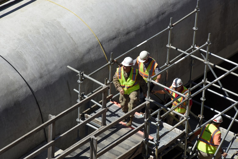 Lt. Gen. Todd T. Semonite, U.S. Army Corps of Engineers commander and chief of engineers, walks up a makeshift stairwell after seeing the through-sill water intakes, which are giant 150-foot wide by 25-foot high tunnelways that will make it possible to fill the lock with 60 million gallons of water in 17 minutes, while touring the Kentucky Lock Addition Project in Grand Rivers, Ky., June 7, 2016. The Nashville District is building the new 1,200-foot by 110-foot lock next to the existing 600-foot by 110-foot lock.