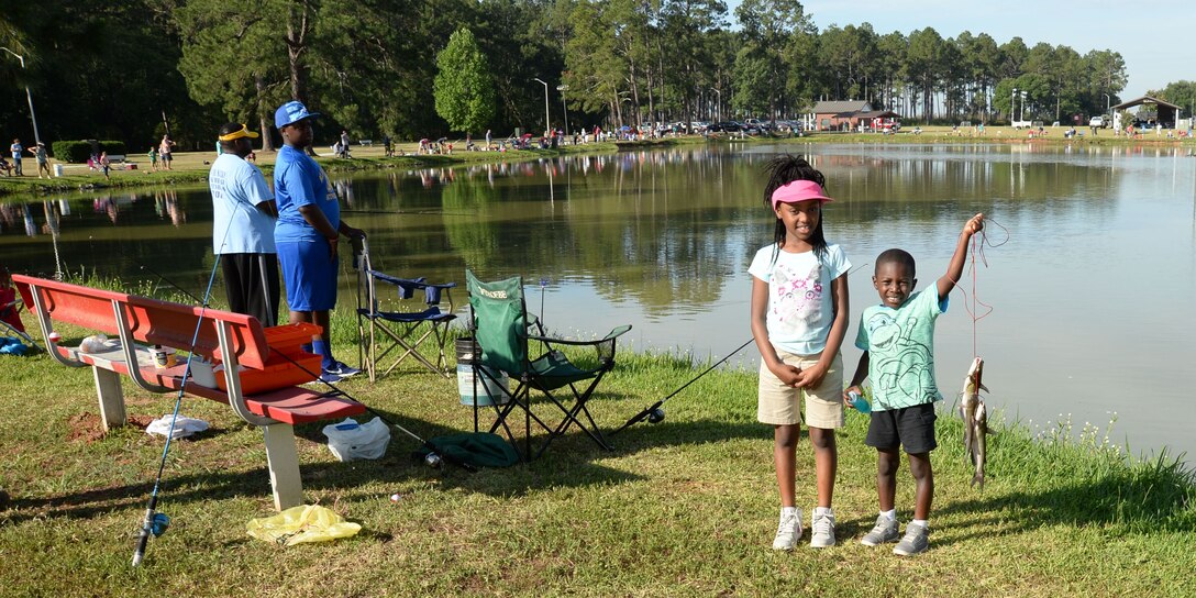Young anglers, four-year old Prez Parks (right) and eight-year old Emmaya Parks are among the fisherman participating in the 28th Annual Buddy Fishing Tournament at Marine Corps Logistics Base Albany, June 4. Several trophies were awarded for the biggest fish in various age groups, at the weigh in at the end of the tournament. The event, held at Covella Pond, here, is opened to community youth 15 years and younger.