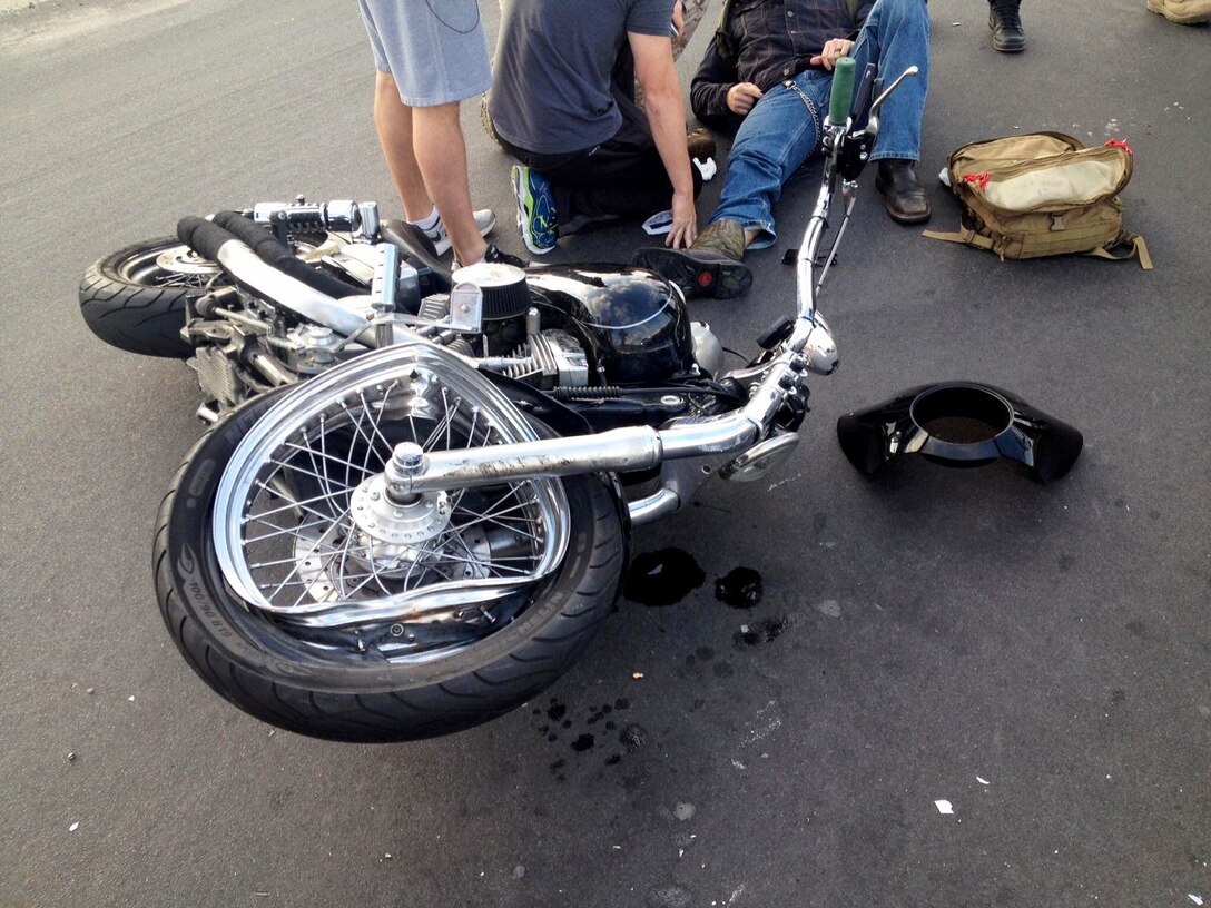 U.S. Marine Sgt. Brandon Jackson is treated for injuries sustained in a motorcycle accident by corpsmen aboard Camp Pendleton, Calif., May 23, 2016. Jackson,an airframes mechanic instructor at the Center for Naval Aviation Technical Training, was on his daily commute to work when he collided with a passenger vehicle. He sustained only minor injuries in the accident. (Courtesy Photo)