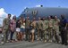 Airmen gather with Col. Sean Farrell, commander of the 1st Special Operations Wing, after his final flight at Hurlburt Field, Fla., June 7, 2016. Farrell has logged more than 3,500 flight hours in his career and served as the 1 SOW installation commander for the past 18 months. (U.S. Air Force photo by Airman 1st Class Joseph Pick)