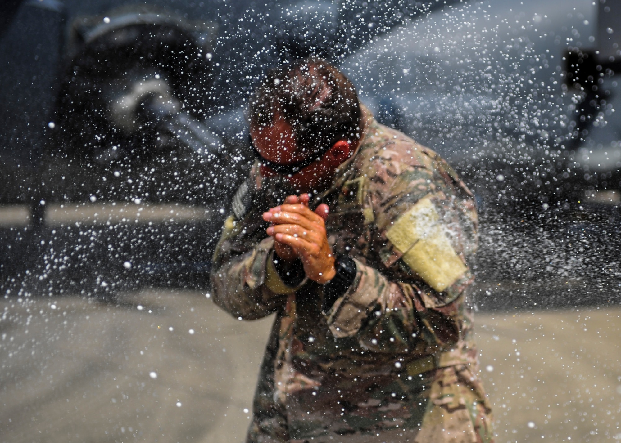 Col. Sean Farrell, commander of the 1st Special Operations Wing, is sprayed with water following his final flight at Hurlburt Field, Fla., June 7, 2016. Farrell has logged more than 3,500 flight hours in his career and served as the 1 SOW installation commander for the past 18 months. (U.S. Air Force photo by Airman 1st Class Joseph Pick)