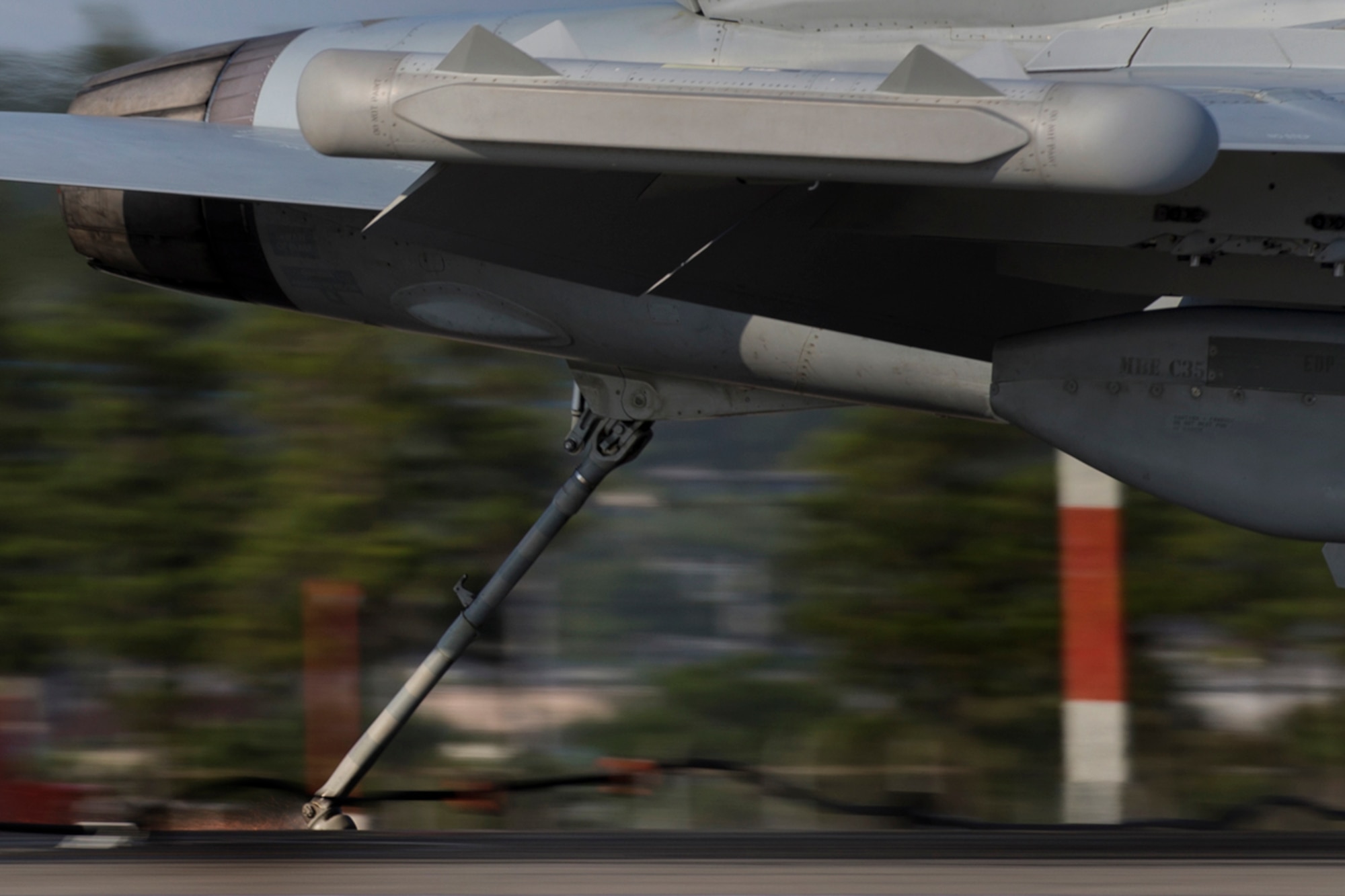 A Navy EA-18G Growler, assigned to the Electronic Attack Squadron (VAQ) 138, engages the aircraft arresting cable at a speed of 150 mph, testing the arresting system, June 3, 2016, at Yokota Air Base, Japan. The 374th Civil Engineer Squadron power productions shop and fire department and the 374th Operations Support Squadron airfield management flight are responsible for testing the arresting system annually. (U.S. Air Force photo by Yasuo Osakabe/Released)