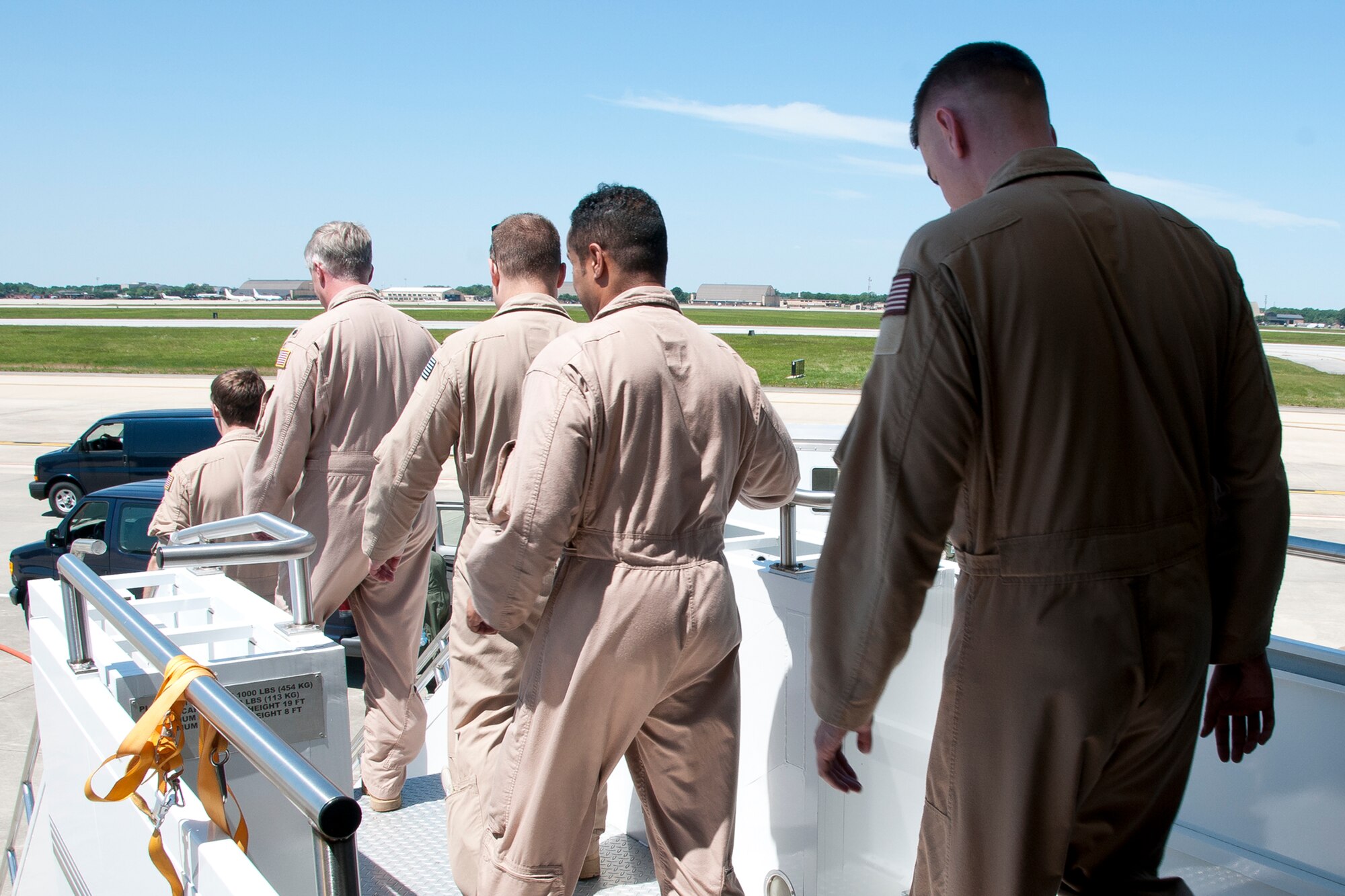 A crew of 459th Air Refueling Wing pilots and boom operators disembark from a KC-135R Stratotanker on the Joint Base Andrews, Md., flight line upon return from a deployment June 9, 2016. The Airmen were deployed to Turkey to provide refueling support as part of Operation Inherent Resolve. (U.S. Air Force photo/Staff Sgt. Kat Justen)