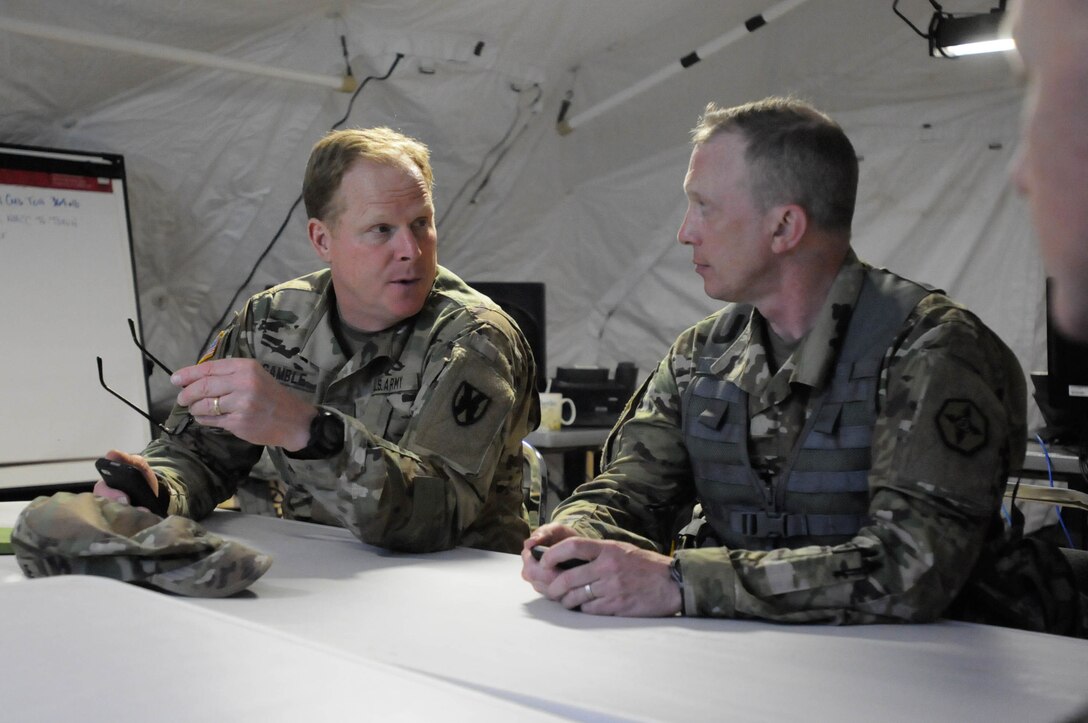 Maj. Gen. Duane A. Gamble, commander of the 21st Theater Sustainment Command, visits with Brig. Gen. Gregory J. Mosser, 
commander of the 364th Expeditionary Sustainment Command, to discuss the success and performance of the 364th ESC during Anakonda 2016, in Warsaw, Poland, June 9. Anakonda 2016 is one of U.S. Army Europe's premier multinational training events, which features 24 nations and seeks to train, exercise and integrate Polish national command and force structures into an allied, joint, multinational environment. (U.S. Army photo by Sgt. Kayla F. Benson, 96th Sustainment Brigade)