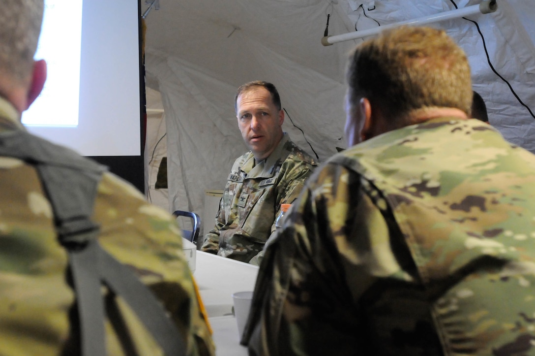 Col. Anthony Naples, deputy commanding officer with the 364th Expeditionary Sustainment Command, briefs Maj. Gen. Duane A. Gamble, commander of the 21st Theater Sustainment Command, and Brig. Gen. Gregory J. Mosser, 
commander of the 364th ESC, regarding the success and performance of the unit during Anakonda 2016, in Warsaw, Poland, June 9. Anakonda 2016 is one of U.S. Army Europe's premier multinational training events, which features 24 nations and seeks to train, exercise and integrate Polish national command and force structures into an allied, joint, multinational environment. (U.S. Army photo by Sgt. Kayla F. Benson, 96th Sustainment Brigade)