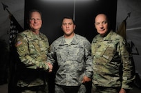 Maj. Gen. Duane A. Gamble, commander of the 21st Theater Sustainment Command, and Command Sgt. Maj. Stanley O. Richards, Interim Command Sergeant Major of the 21st TSC, pose with Spc. Daniel F. Kovitch, with the 412th Engineer Company, after presenting him with a commanders coin during Anakonda 2016, in Warsaw, Poland, June 9. Anakonda 2016 is one of U.S. Army Europe's premier multinational training events, which features 24 nations and seeks to train, exercise and integrate Polish national command and force structures into an allied, joint, multinational environment. (U.S. Army photo by Sgt. Kayla F. Benson, 96th Sustainment Brigade)