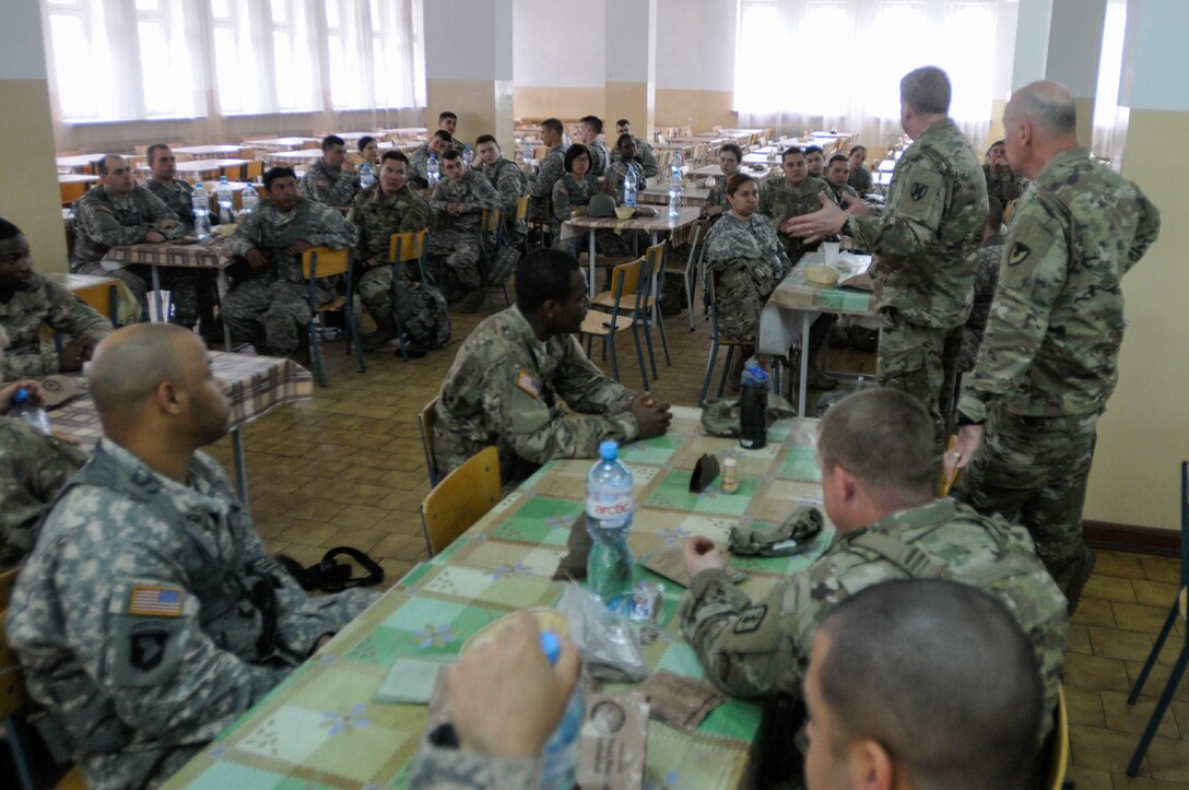 Maj. Gen. Duane A. Gamble, commander of the 21st Theater Sustainment Command, visits with enlisted Army Reserve soldiers with the 364th Expeditionary Sustainment Command  during Anakonda 2016, in Warsaw, Poland, June 9. Anakonda 2016 is one of U.S. Army Europe's premier multinational training events, which features 24 nations and seeks to train, exercise and integrate Polish national command and force structures into an allied, joint, multinational environment. (U.S. Army photo by Sgt. Kayla F. Benson, 96th Sustainment Brigade)