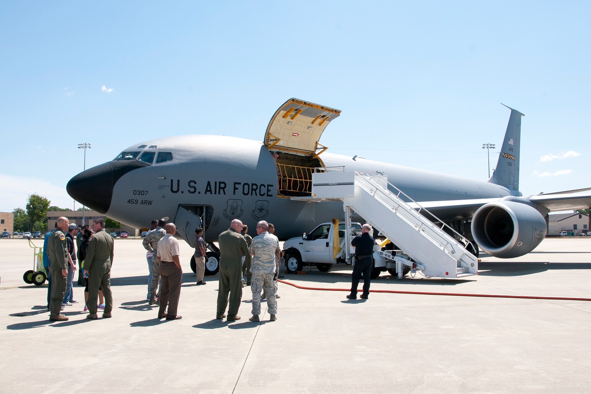 Members of the 459th Air Refueling Wing wait for re-deployers to disembark from a KC-135R Stratotanker on the Joint Base Andrews, Md., flight line June 9, 2016. The aircraft had just returned from Turkey, where it provided refueling support as part of Operation Inherent Resolve. (U.S. Air Force photo/Staff Sgt. Kat Justen)  